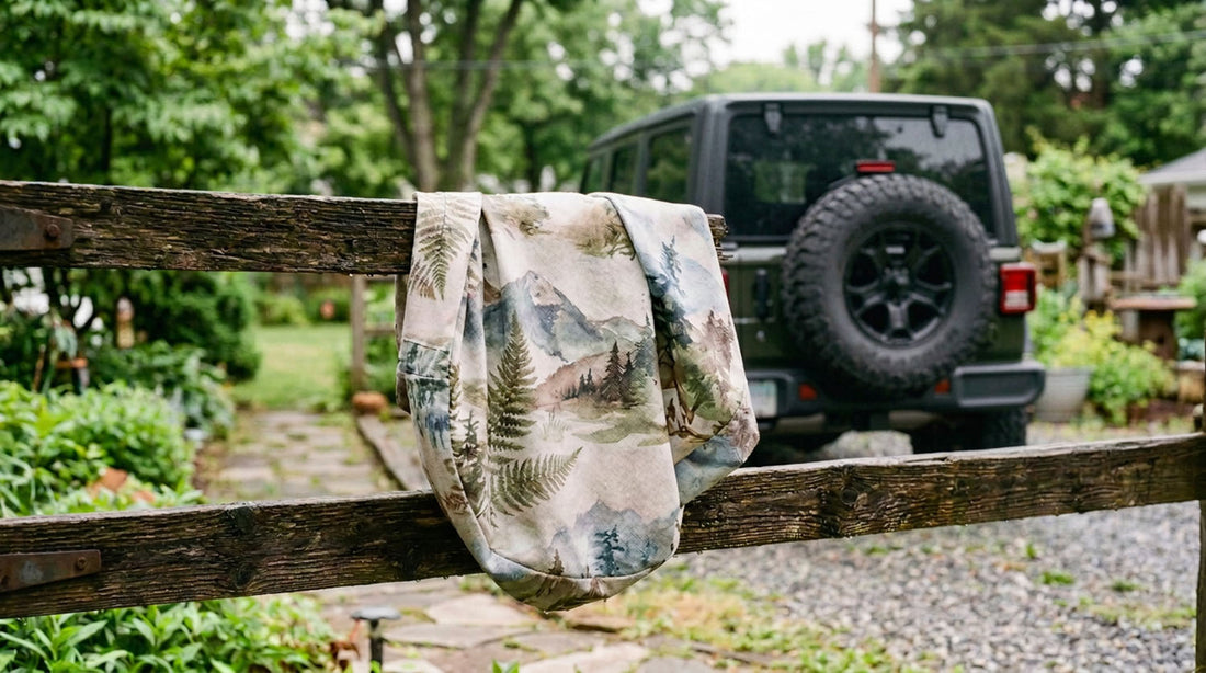 Printed fabric spare tire cover removed from the vehicle and washed by hand with a soft brush and soapy water on a driveway
