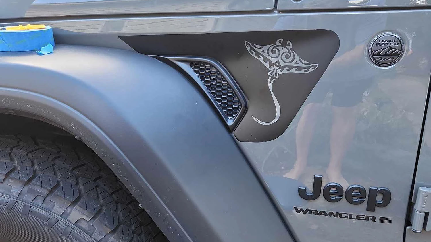 Printed vinyl fender vent graphic installed on the front fender vent of a Jeep Wrangler