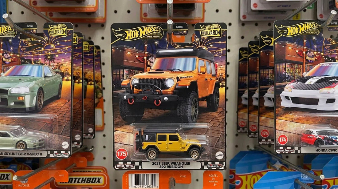 Hot Wheels Premium Boulevard card for the 2021 Jeep Wrangler 392 Rubicon, number 175, hanging on a store pegboard with the yellow diecast visible in the bubble