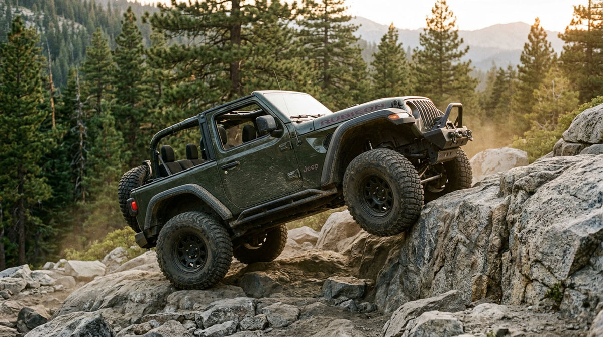 A hand on the transfer case shift lever in a Jeep Wrangler, shifting between four-wheel drive ranges
