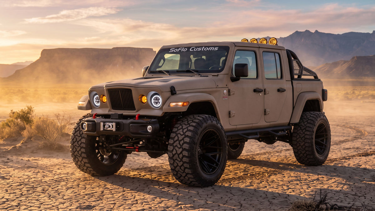 SoFlo Customs Kaizer Edition Jeep Gladiator in tan Kevlar armor finish with roll cage, light bar, and 40-inch off-road tires
