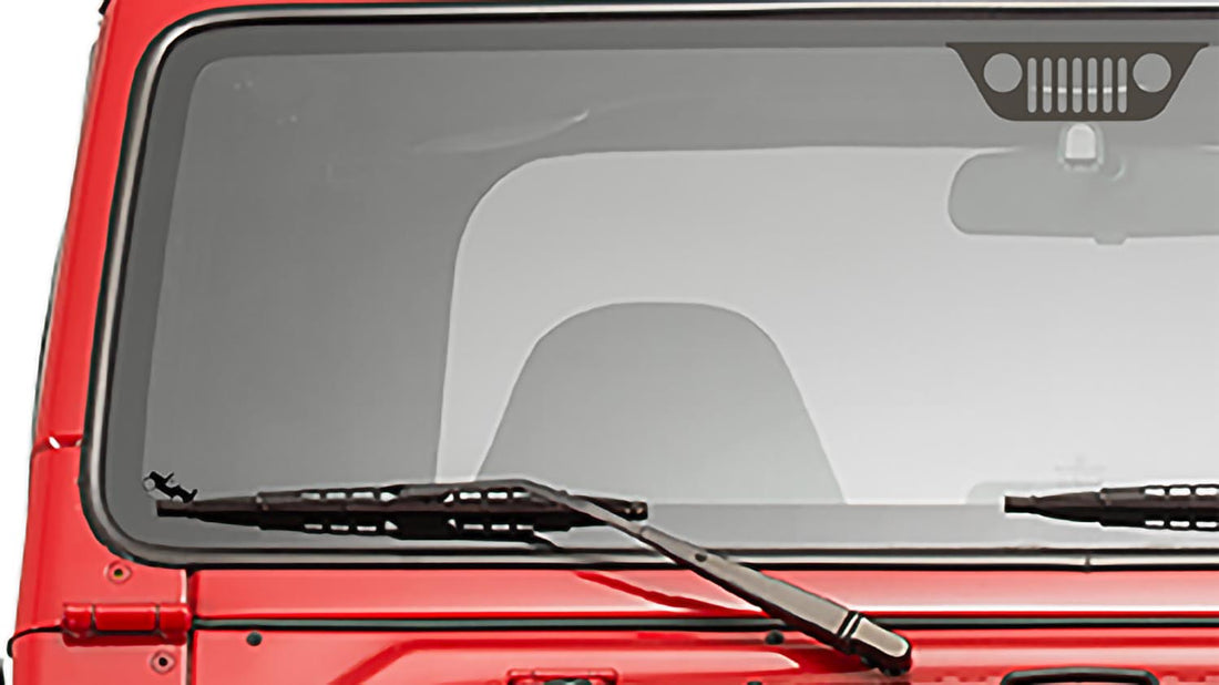 Jeep JK Wrangler windshield with a 1941 Willys Easter egg replacement decal in the lower corner