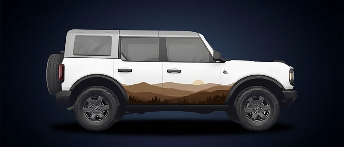 White four-door Ford Bronco in profile with the Horizon Earthtones side graphic, a brown and tan mountain range and treeline running along the lower doors