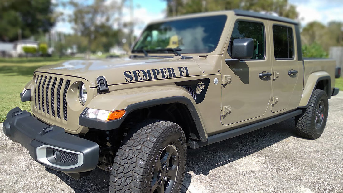 Gator Green Jeep with a custom edition hood decal on the trail