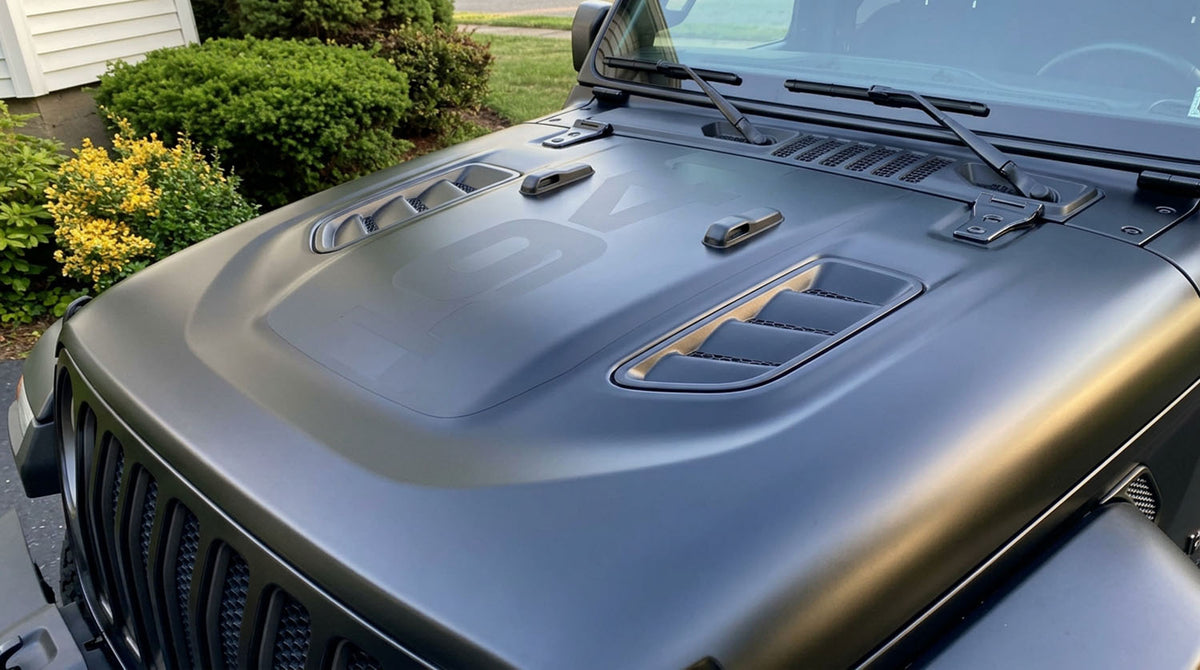 Matte black Jeep Wrangler Rubicon power dome hood with vent scoops