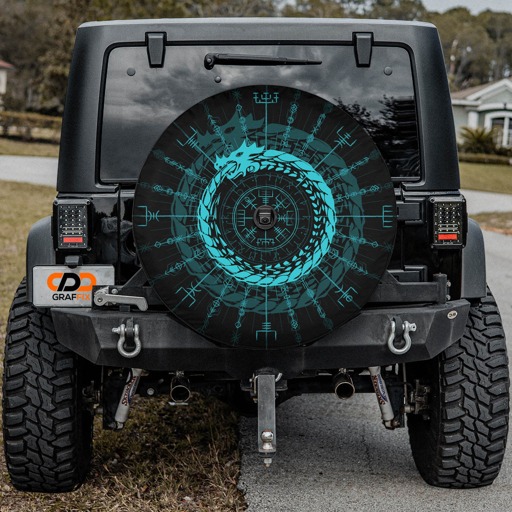 the rear of a black Jeep Wrangler with a large, colorful wheel cover featuring a dragon design.