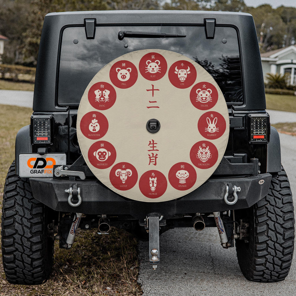 a black jeep with a large, round, red and white sticker on the rear window. The sticker features various Chinese zodiac animals, including a pig, a dog, a cat, a rooster, a rabbit, a snake, a horse, a monkey, a dragon, a horse, a monkey, and a rabbit.