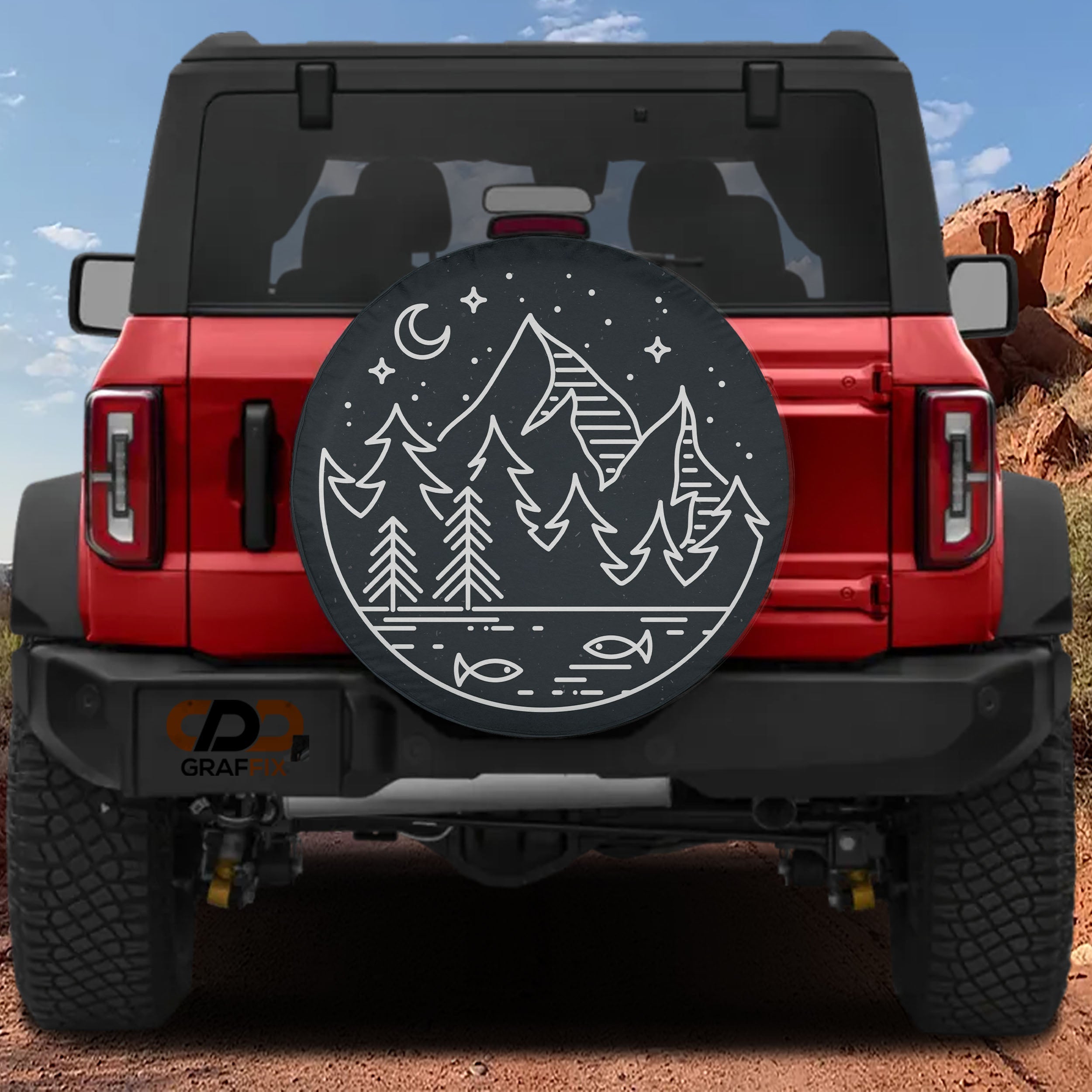 Midnight Pines spare tire cover with line-art landscape shown on red Bronco CDD GRAFFIX brand