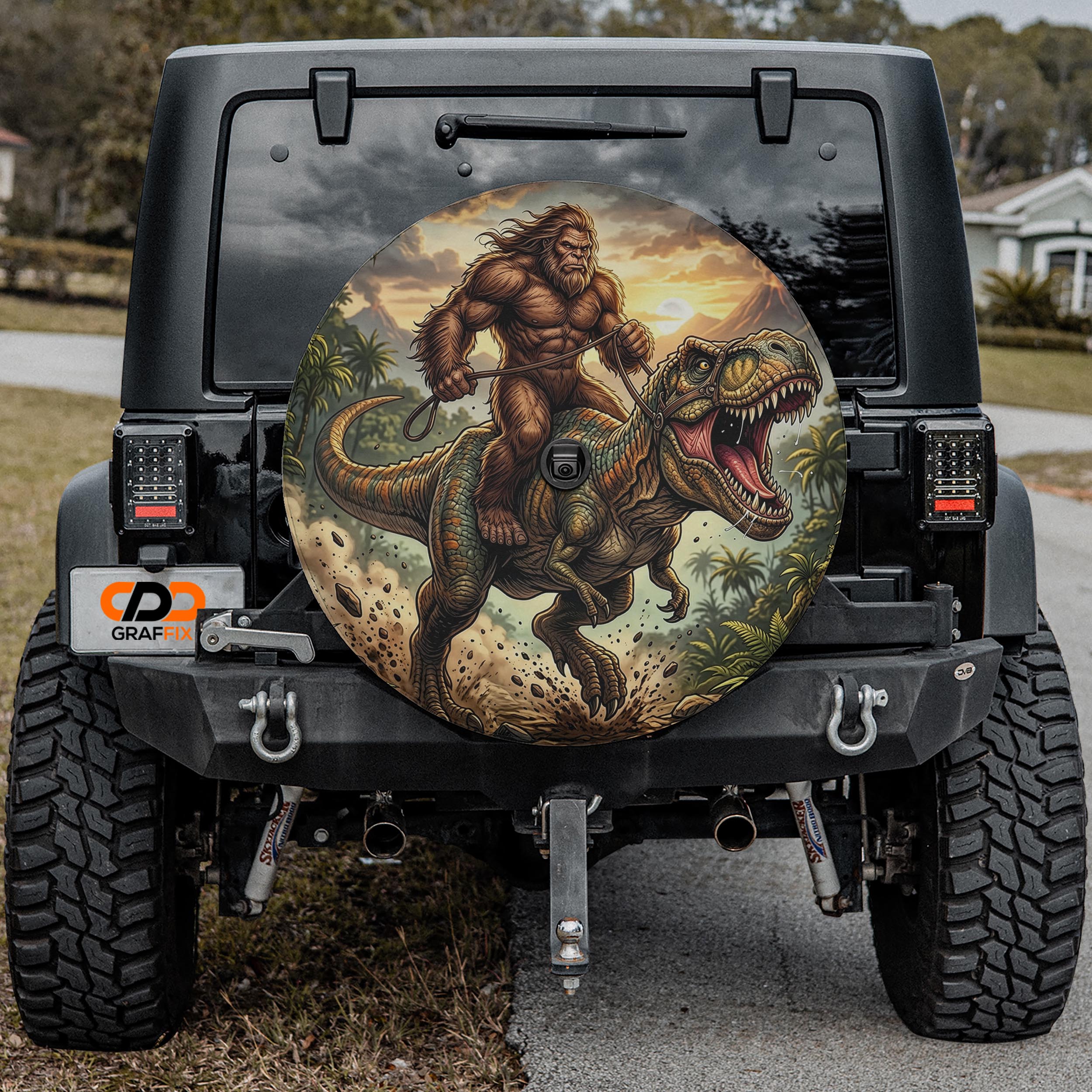 a Jeep Wrangler with a large dinosaur-themed decal on the rear window.