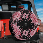 Japanese pink cherry blossom black background spare tire cover installed on red Jeep Wrangler rear