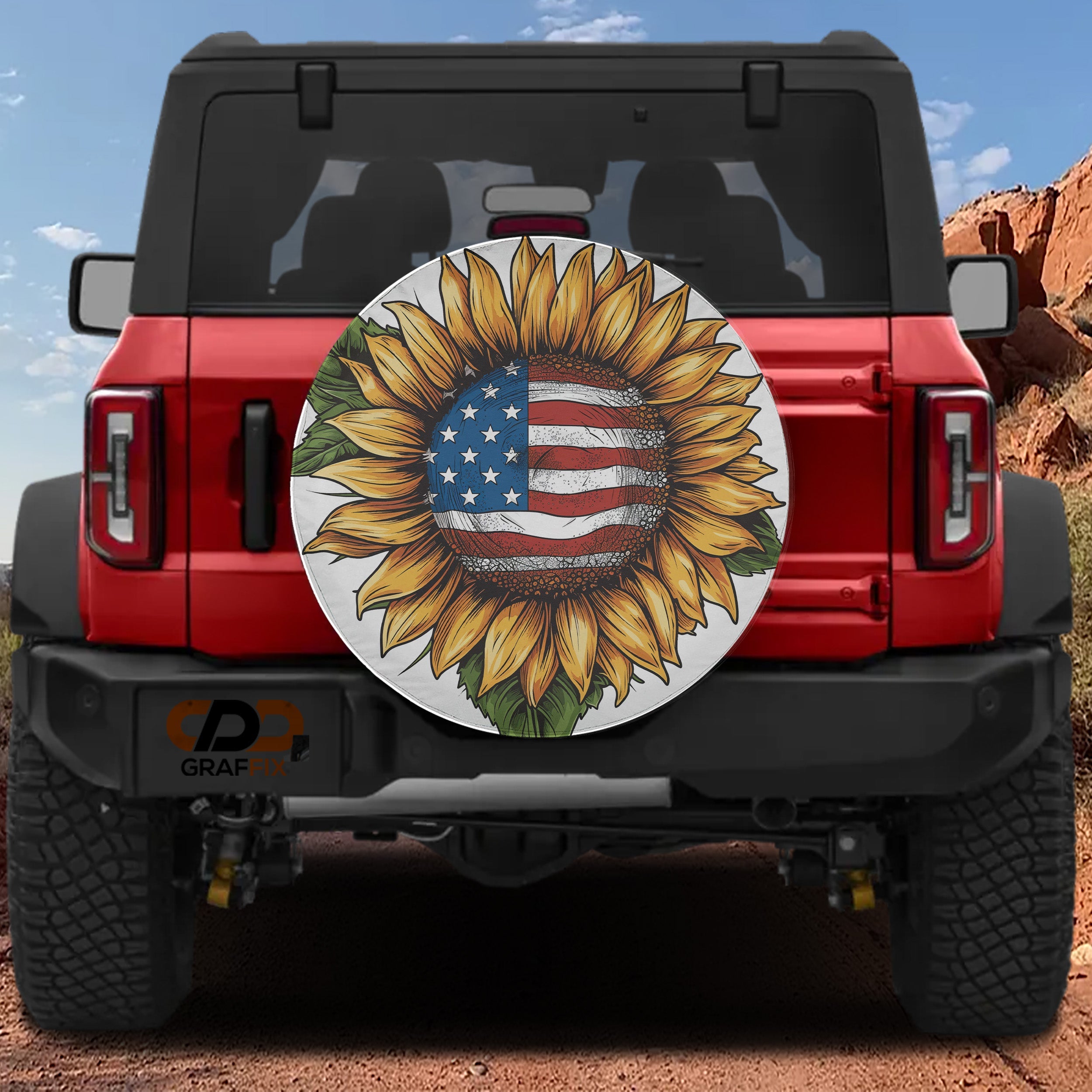 Star-Spangled Sunflower spare tire cover on a red Jeep Wrangler showing the patriotic flag-and-bloom rear design
