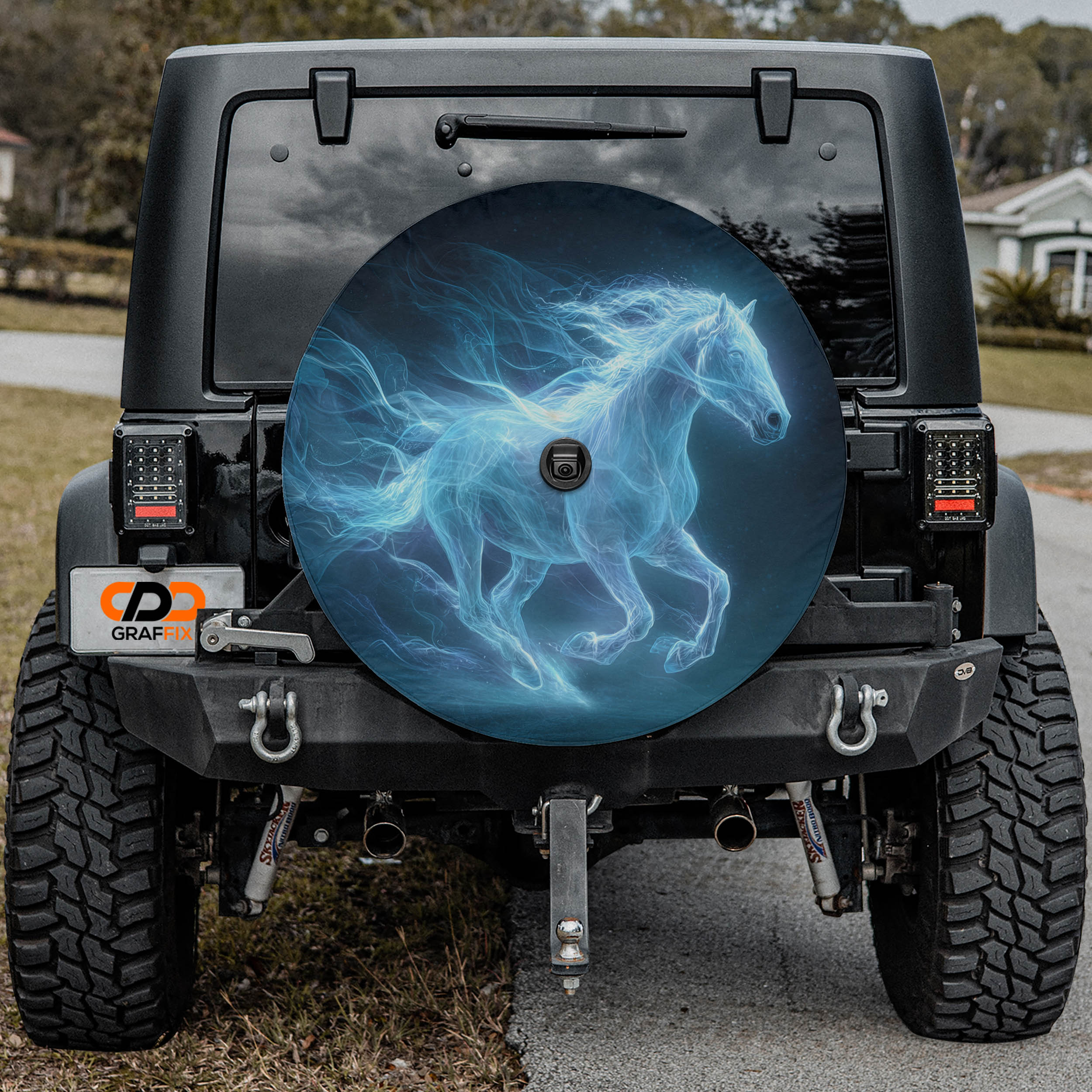 a black Jeep Wrangler with a large, round spare tire cover that displays a ghostly image of a horse running.