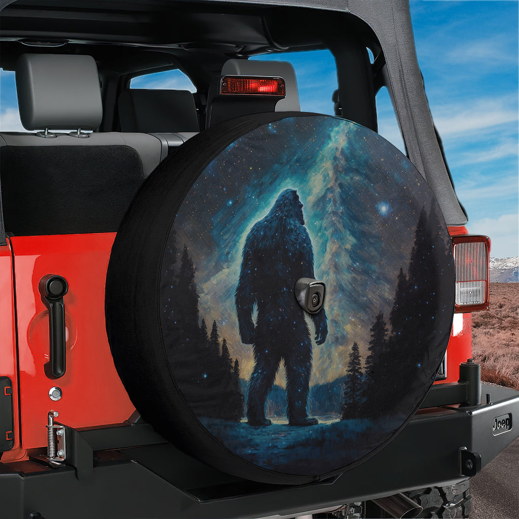 Celestial Yeti Chronicles spare tire cover on red Jeep Wrangler with cosmic bigfoot night sky design