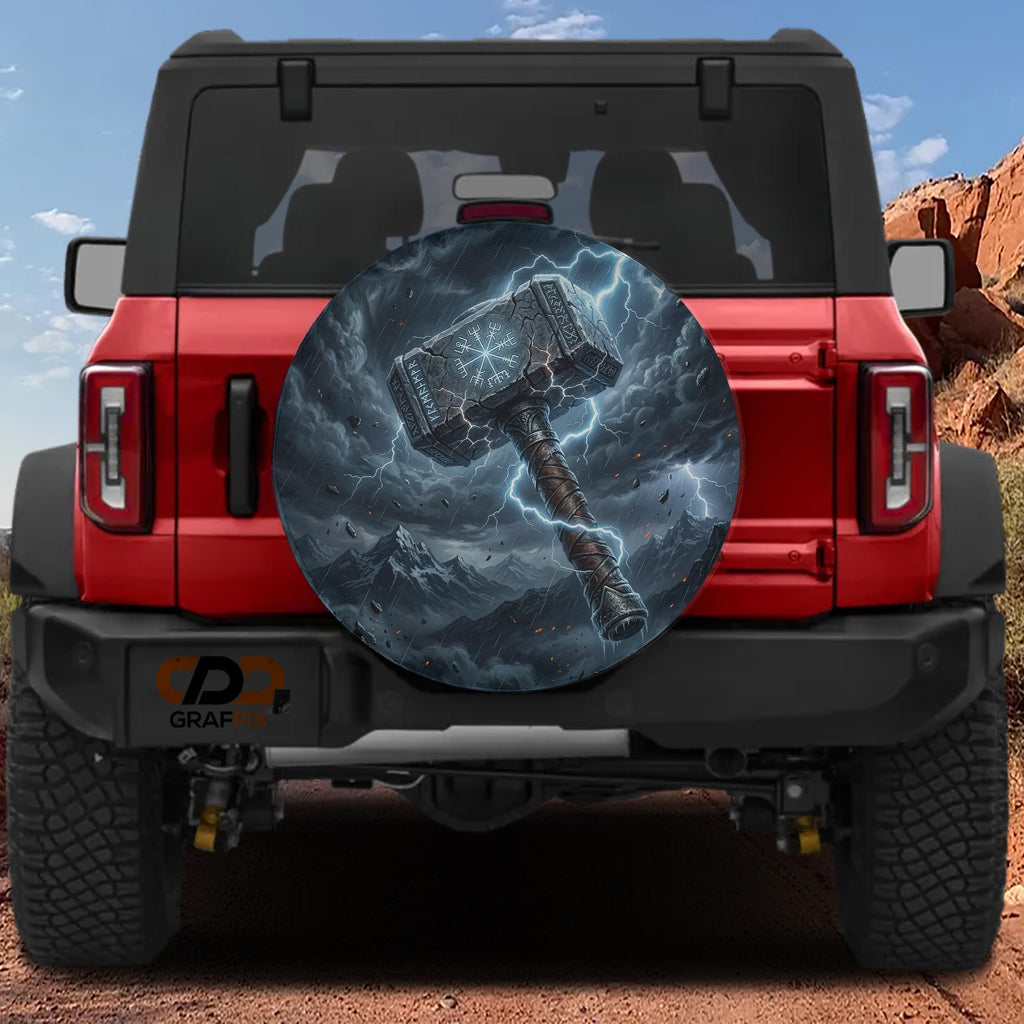 a red Jeep Wrangler with a large, detailed graphic of a hammer on the rear window.