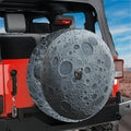 Dark Side of the Moon spare tire cover on red Jeep Wrangler showing gray lunar crater surface
