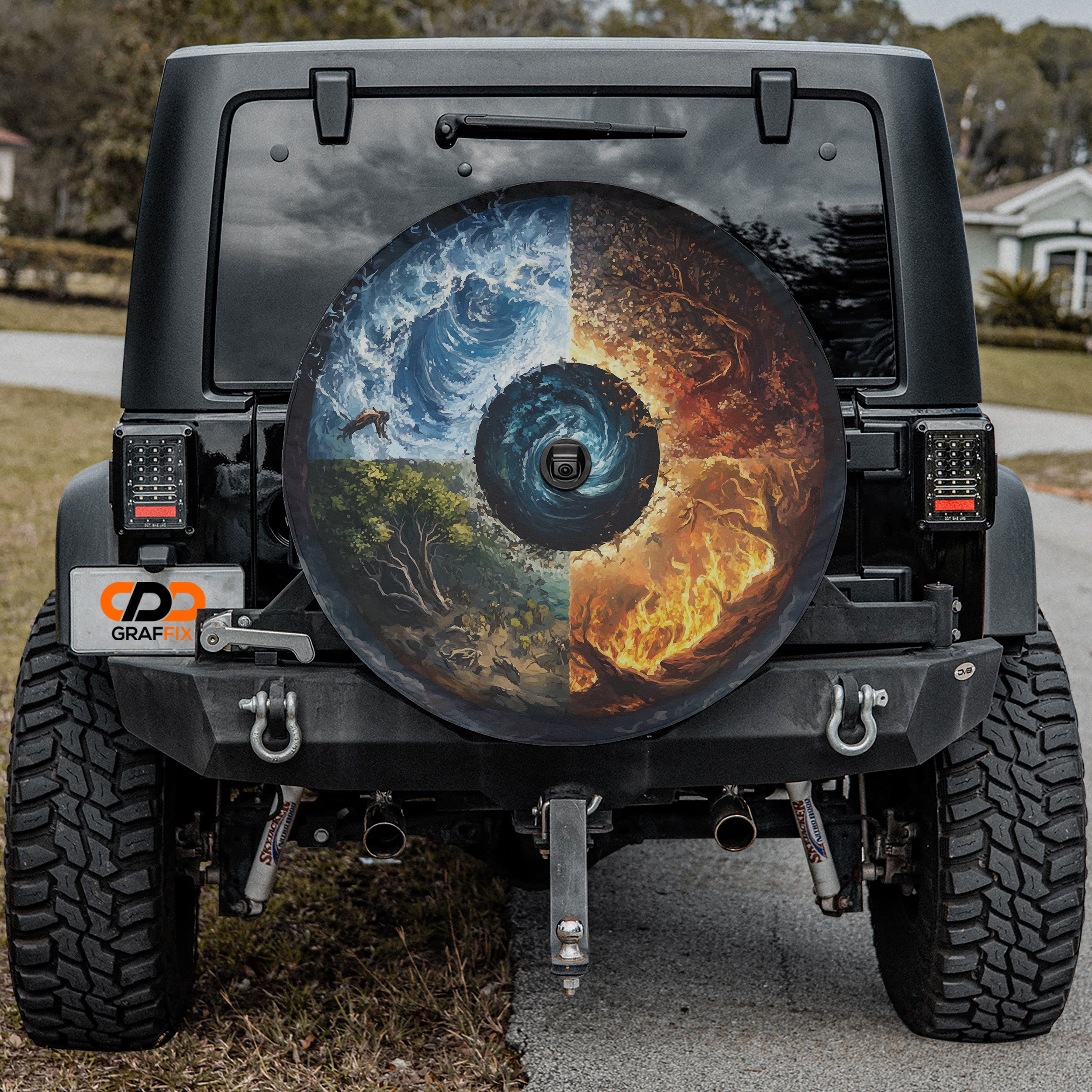 Black Jeep Wrangler displaying Wheel of Elements spare tire cover with elemental symbol design