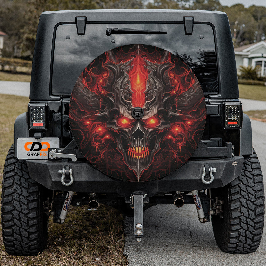 Emberlord Skull spare tire cover installed on black Jeep Wrangler with GRAFFIX license plate