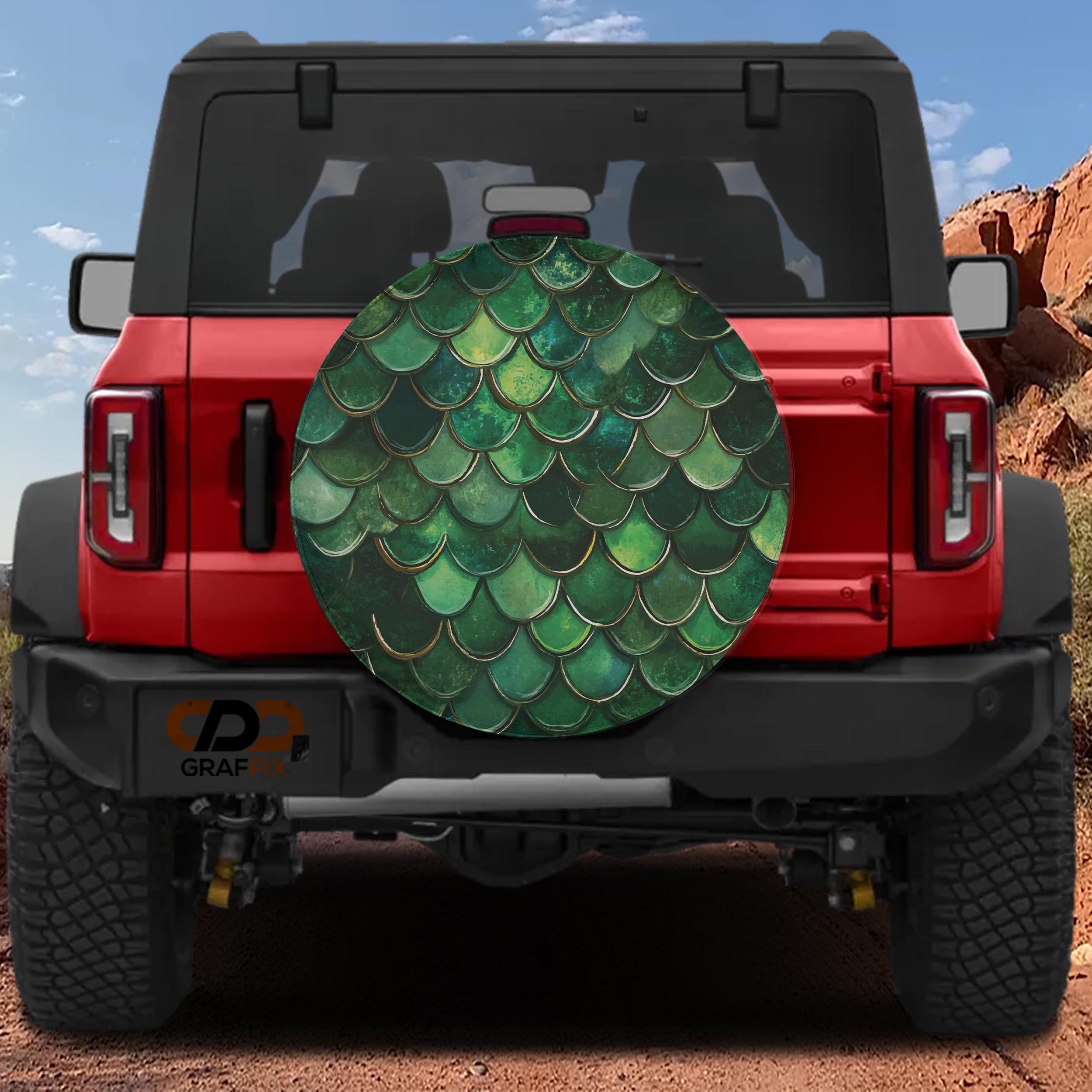 Green Mermaid Scale spare tire cover on a red Bronco rear with shimmering layered green scale pattern artwork