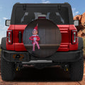 Shelfside Shenanigans spare tire cover on a red Jeep Wrangler showing the holiday elf perched on a circular cover