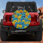 Happy smiley parade tire cover on red Ford Bronco with packed yellow and blue cartoon smiling emoji faces