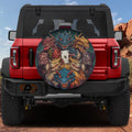 Dragons Ace of Mischief tire cover on a red Ford Bronco with colorful dragon heads circling poker cards