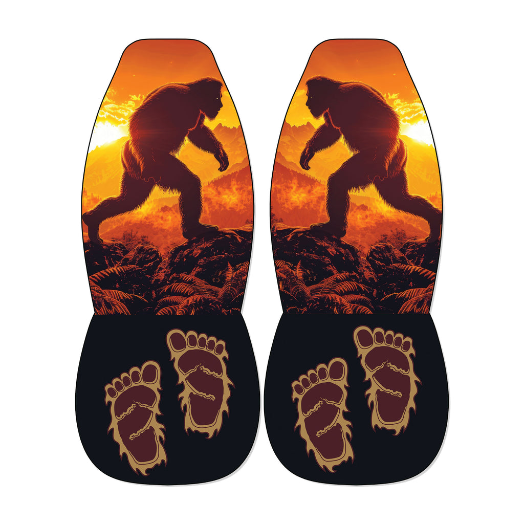 a pair of shoes with a unique design, including a silhouette of a large, furry creature and two feet with an intricate, claw-like pattern.