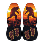 a pair of shoes with a unique design, including a silhouette of a large, furry creature and two feet with an intricate, claw-like pattern.
