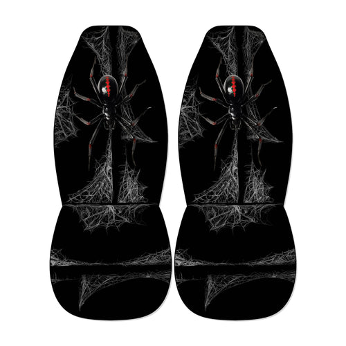 a pair of black car seat covers with a spider design on them.