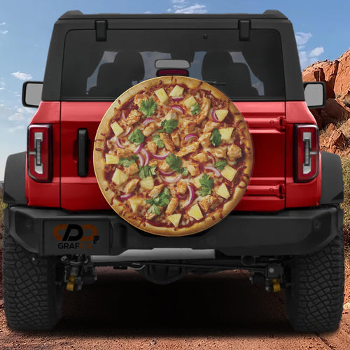 BBQ chicken pizza spare tire cover with grilled chicken pineapple chunks red onion and fresh cilantro