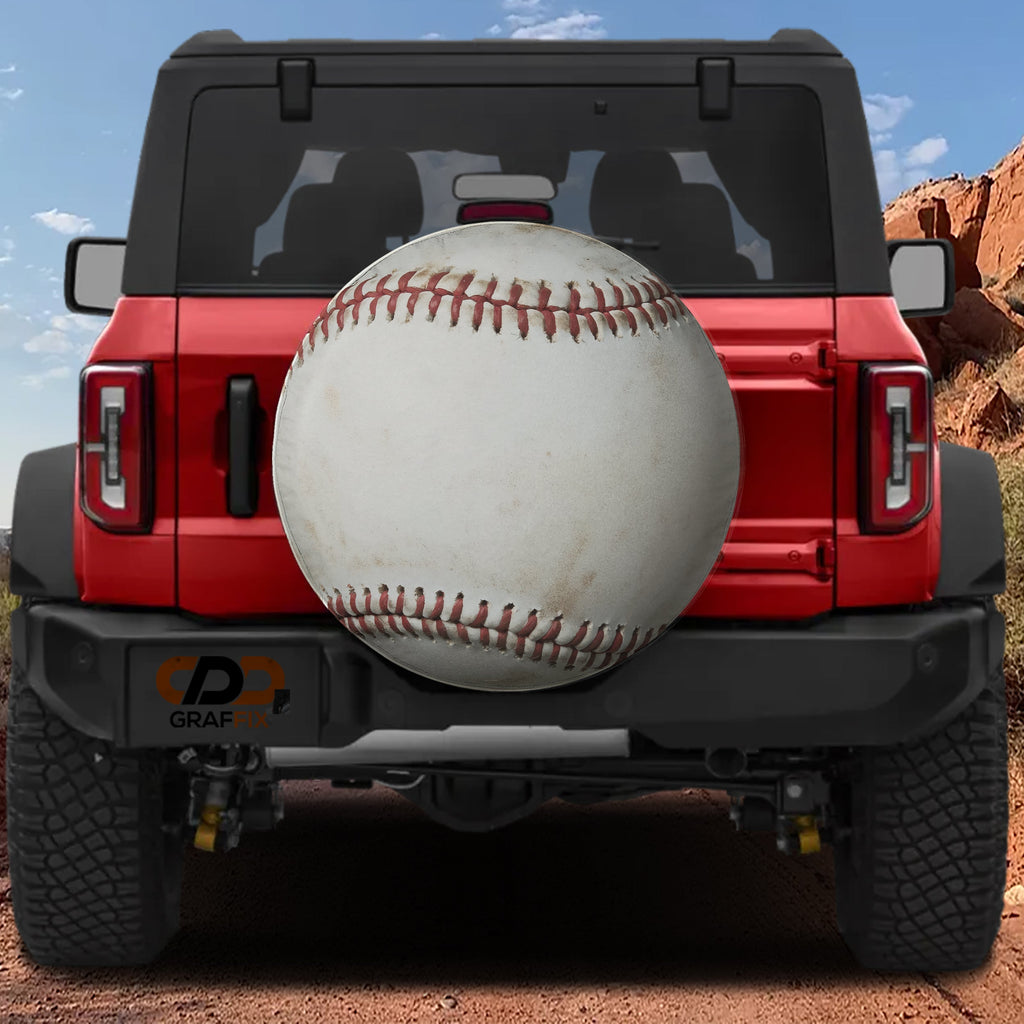 Baseball spare tire cover rear angle view on parked Jeep with backup camera cutout