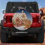 Red Bronco with gingerbread house spare tire cover featuring lollipops candy canes and snowy night sky