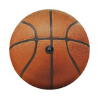 Basketball spare tire cover flat-lay product photo showing realistic orange panel texture