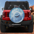 Yeti Peek-a-Boo spare tire cover on a red Jeep Wrangler showing the cheeky cartoon yeti peeking from the rear cover