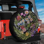 Faux embroidery wildflowers spare tire cover closeup of floral stitching artwork detail