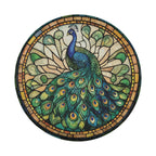 Round peacock mosaic tire cover on white showing teal green tail feathers amber border stained glass