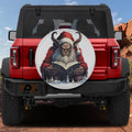 Storytime with Krampus spare tire cover on a red Jeep Wrangler with horned creature reading book