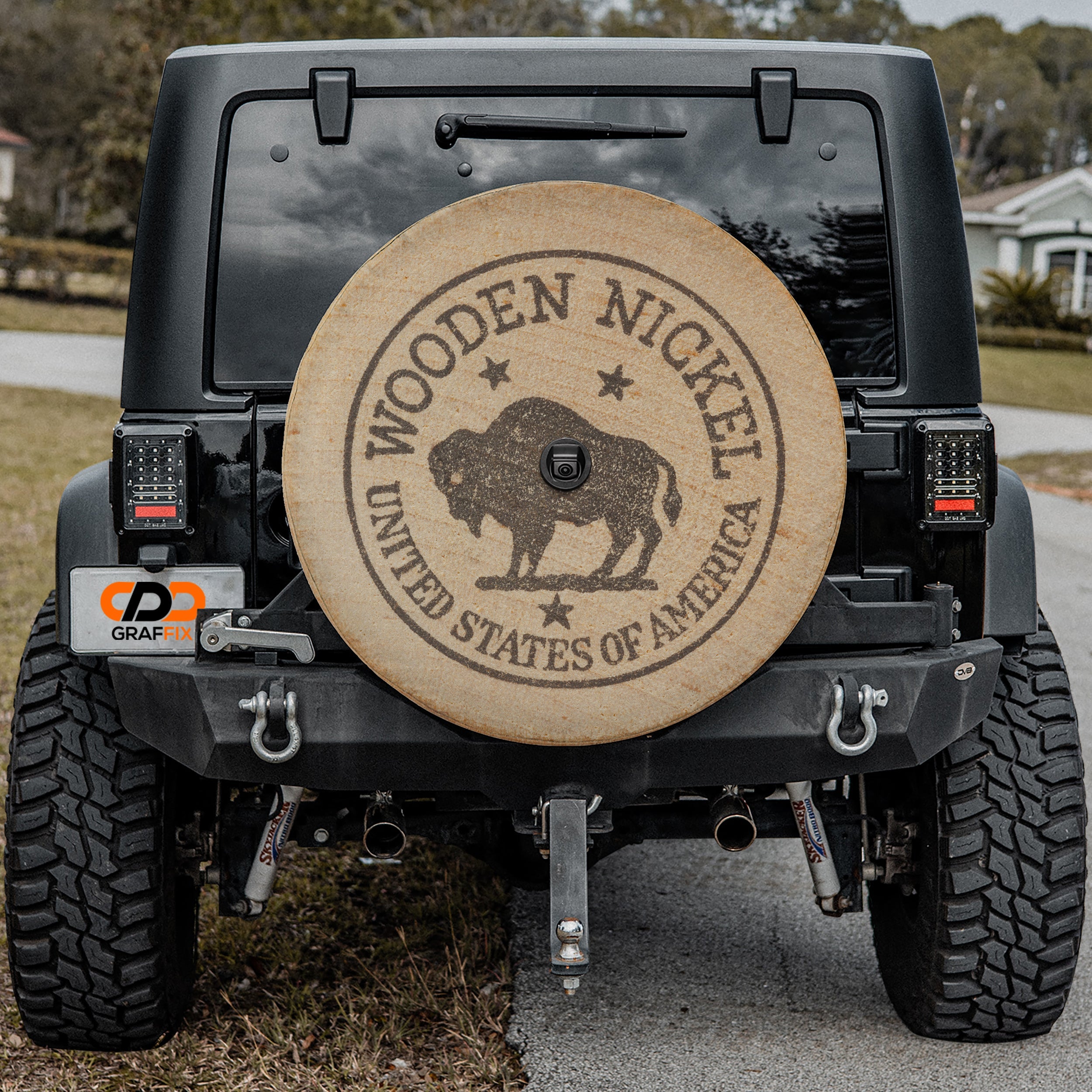 American buffalo wooden nickel spare tire cover on red Ford Bronco with vintage bison coin