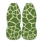 two green and white patterned objects, which appear to be animal-like or geometric shapes, set against a white background.