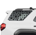 Dog paw print rear quarter window vinyl decal in black on a 2025 Toyota 4Runner