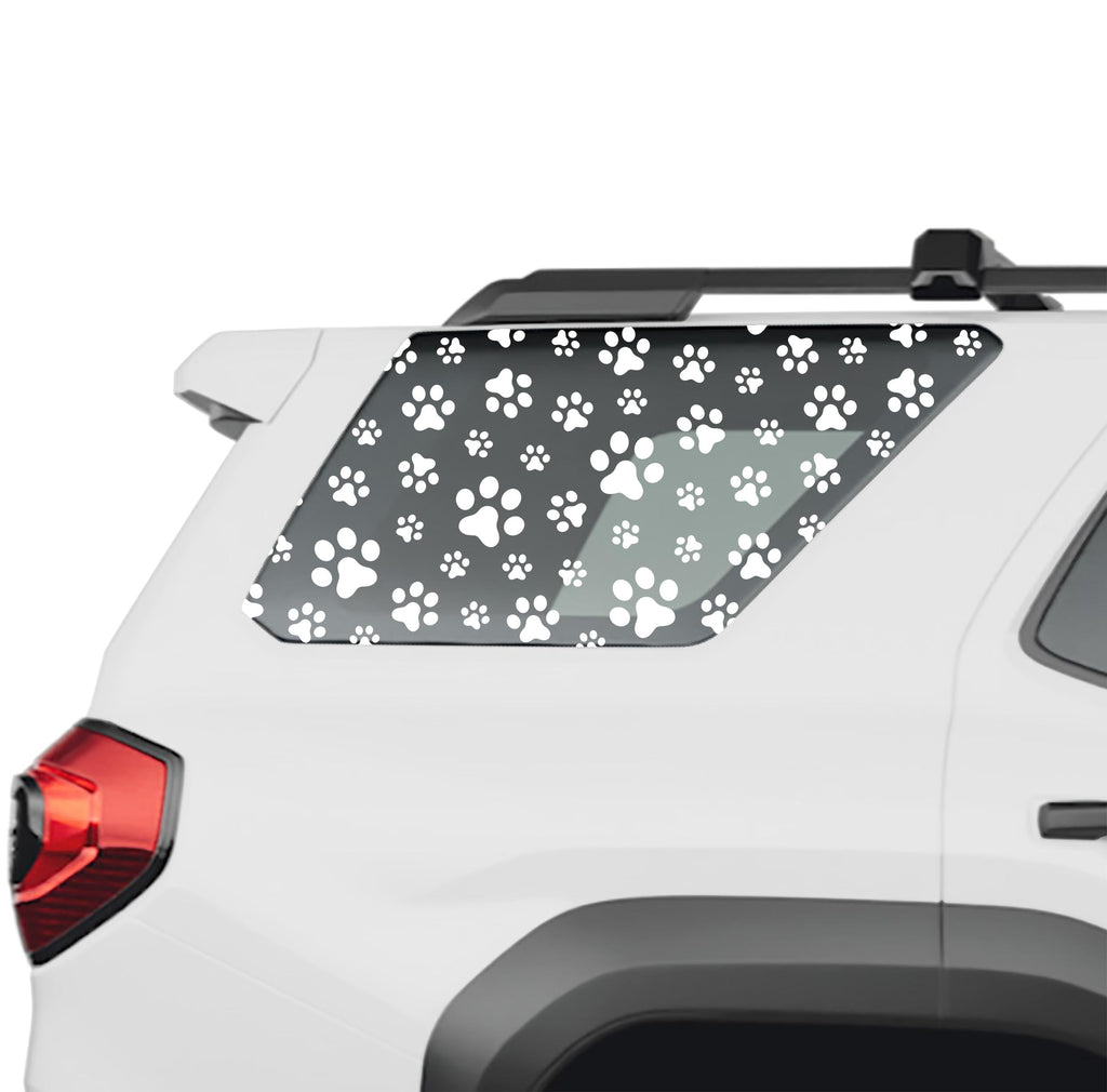 Dog paw print rear quarter window vinyl decal in white on a 2025 Toyota 4Runner