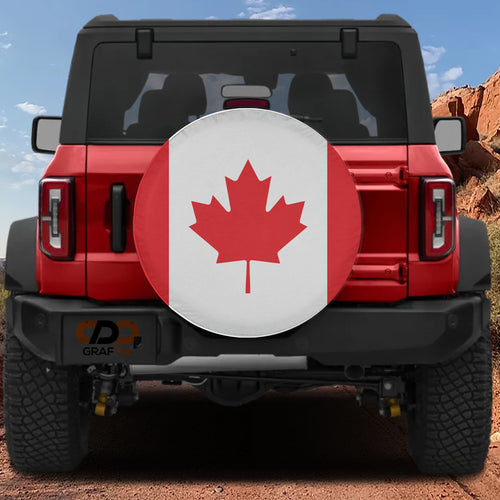 Canadian Maple Leaf flag spare tire cover mounted on red Ford Bronco rear with red rock canyon backdrop