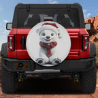 Christmas baby polar bear spare tire cover on black Jeep Wrangler smiling cub red Santa hat scarf