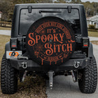 Spooky Bitch Season Halloween tire cover lifestyle shot mounted on rear of Jeep Wrangler