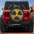 Flat fallout shelter radiation symbol spare tire cover artwork in distressed yellow and black grunge style
