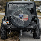 Veterans tribute dog tags Thank You spare tire cover installed on a red Jeep Wrangler tailgate in desert scene