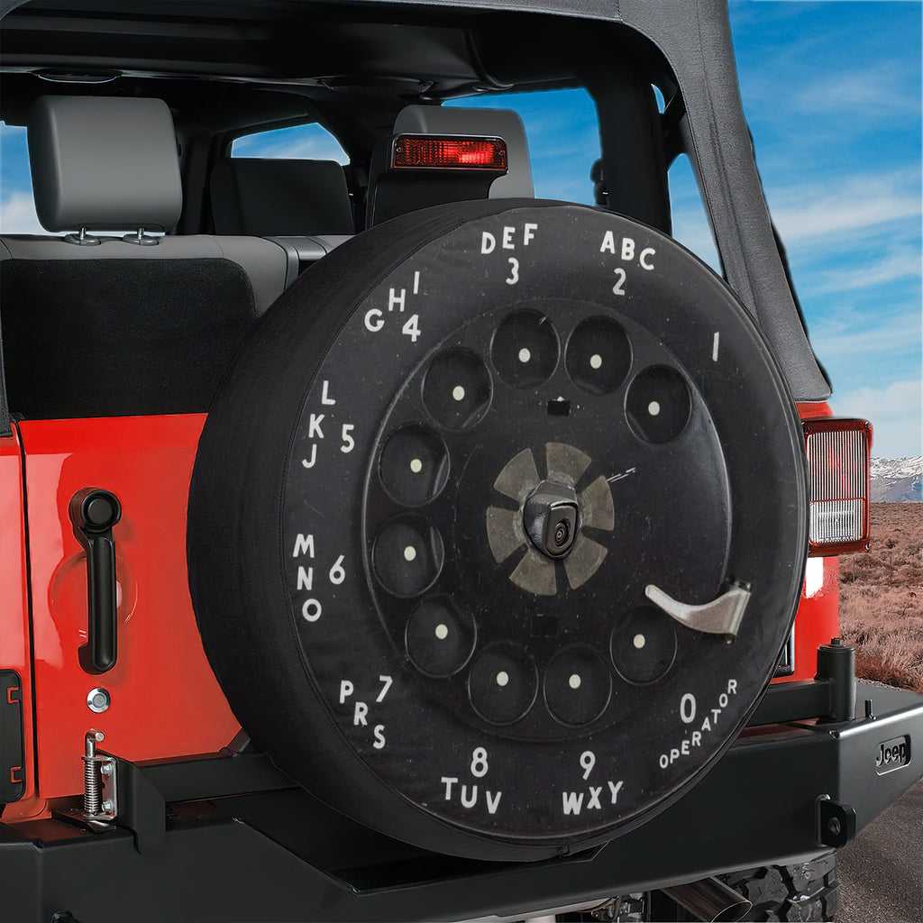 Vintage rotary phone dial spare tire cover on Jeep Wrangler with retro telephone keypad print