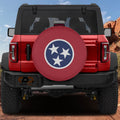 Tennessee state flag spare tire cover mounted on red Ford Bronco rear with red rock canyon backdrop