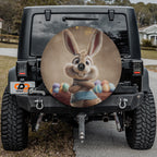 a black jeep with a large round decal of a cartoon rabbit on the rear window.