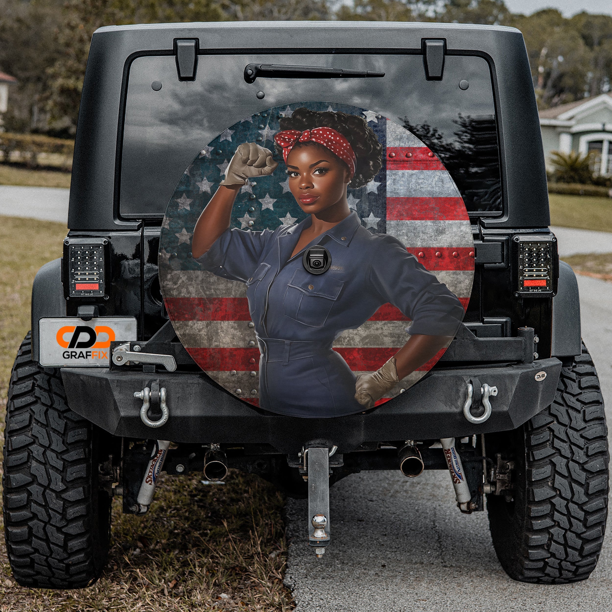 Sisterhood of Steel spare tire cover shown installed on rear of vehicle