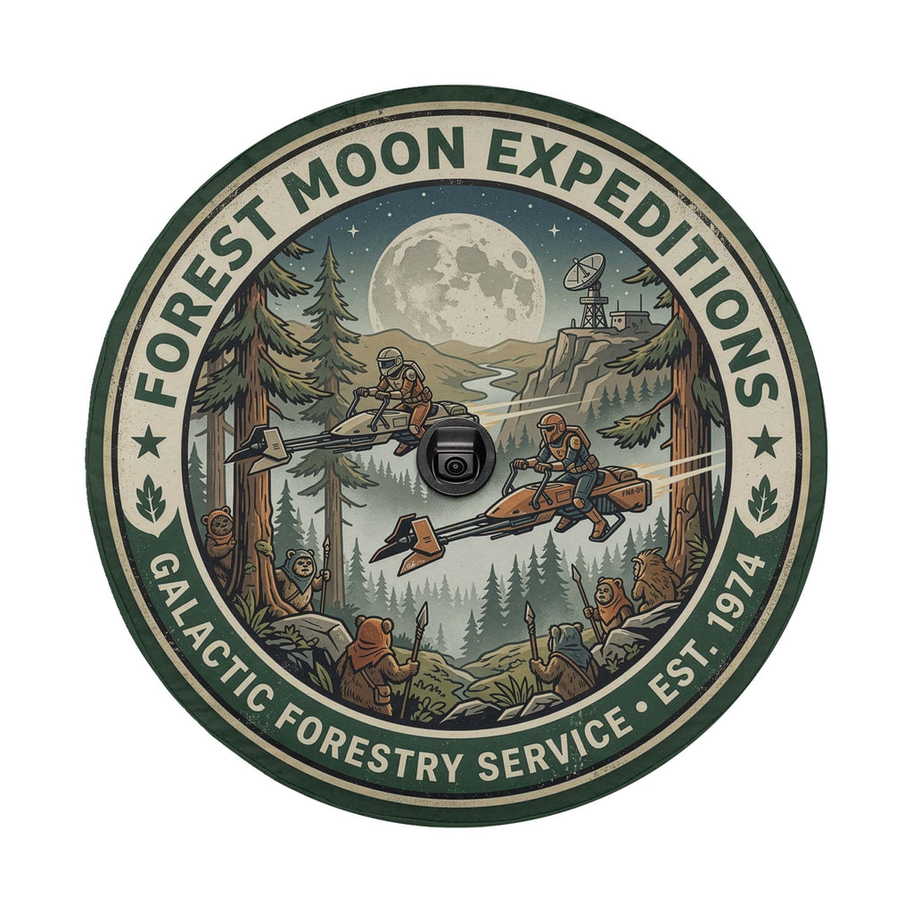 a circular emblem with a forest scene and a large moon in the background. The emblem is surrounded by a green border and includes various elements such as trees, a river, and a large moon.
